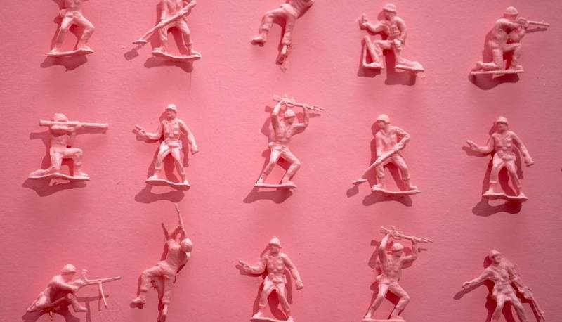 Flat lay of pink toy soldiers
